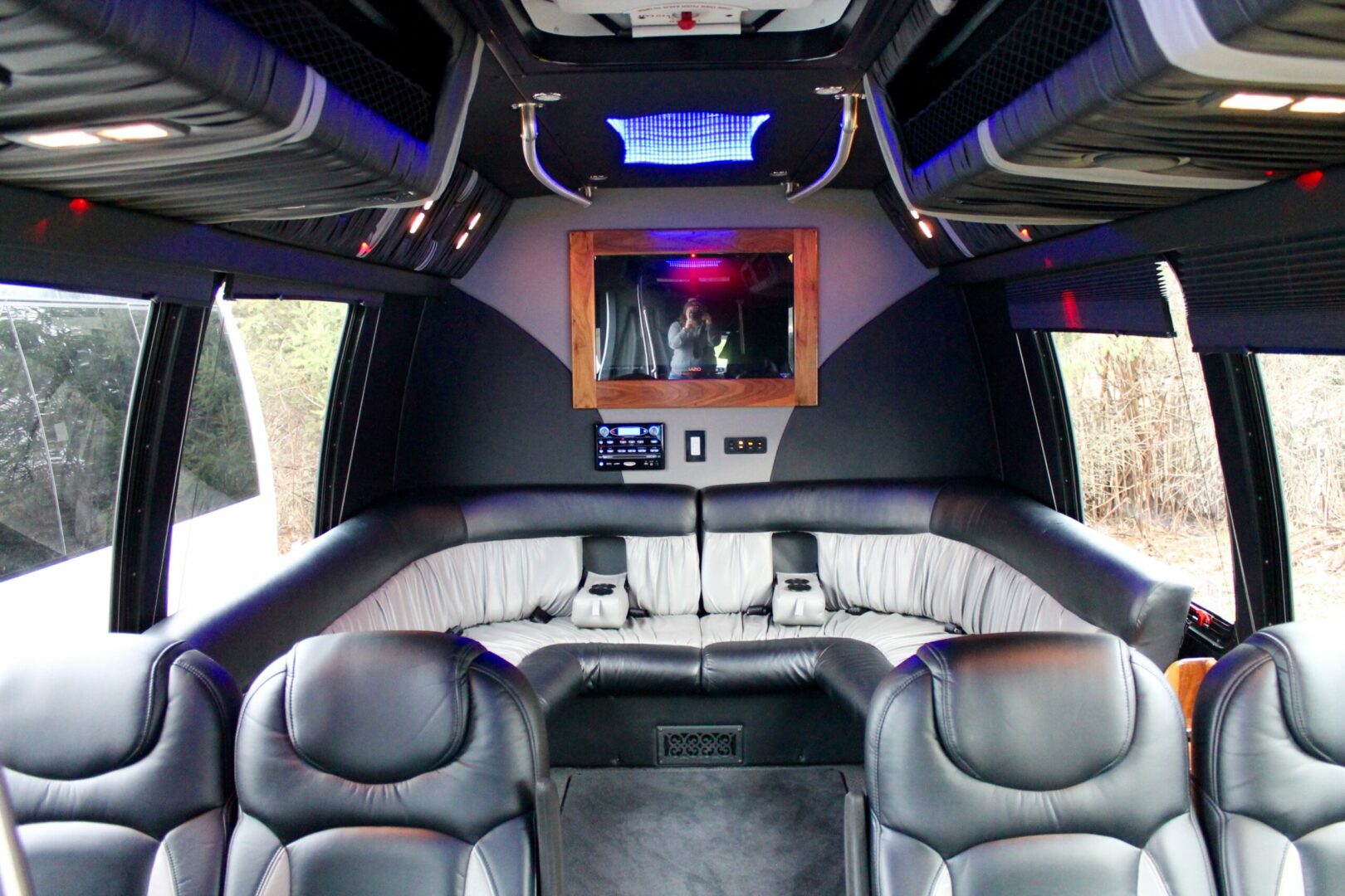 A view of the back seats in a limo.